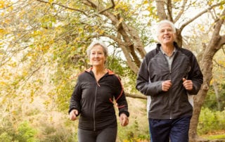 knee injection pain and information showing older couple smiling while running
