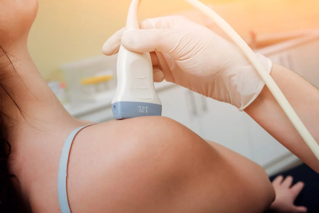 Ultrasound Guided Injections - A woman having an ultrasound on her shoulder