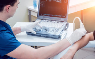 What is an ultrasound guided injection? - Elbow being injected using ultrasound