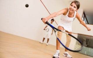 Woman playing squash