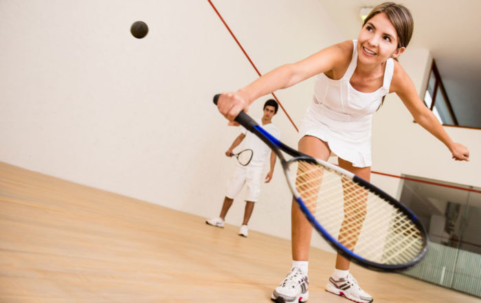 Woman playing squash